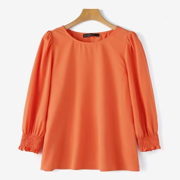 orange colorful short-sleeved blouse on the white background