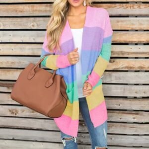 woman wearing pastel cardigan and jeans, she is holding a big brown bag