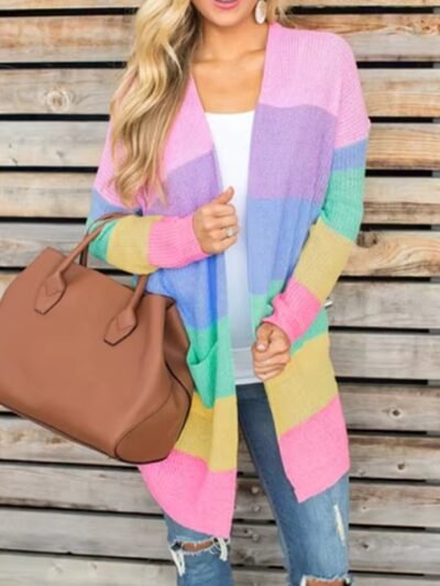 woman wearing pastel cardigan and jeans, she is holding a big brown bag