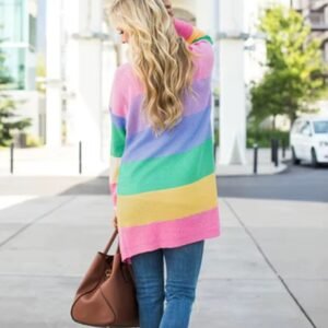 blonde woman turned to her back wearing pastel cardigan, jeans and carrying a brown bag