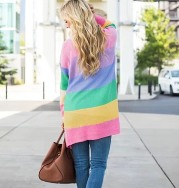 blonde woman turned to her back wearing pastel cardigan, jeans and carrying a brown bag