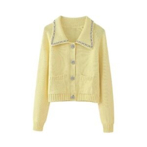 pastel yellow cardigan on the white background