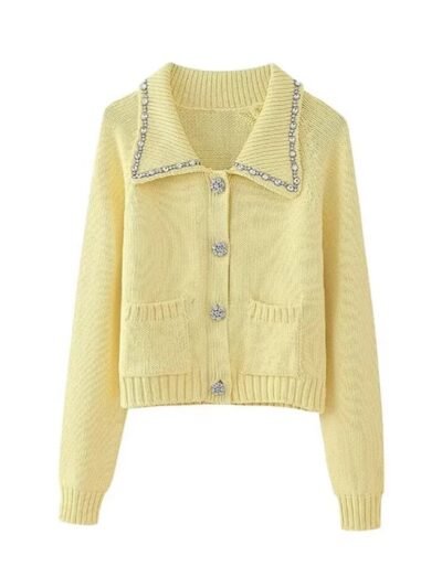 pastel yellow cardigan on the white background