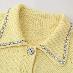 neck of pastel yellow cardigan