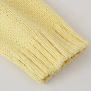 sleeve of pastel yellow cardigan