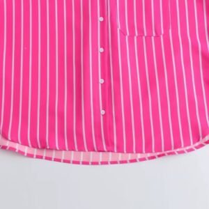 bottom part of pink colorful blouse on the white background