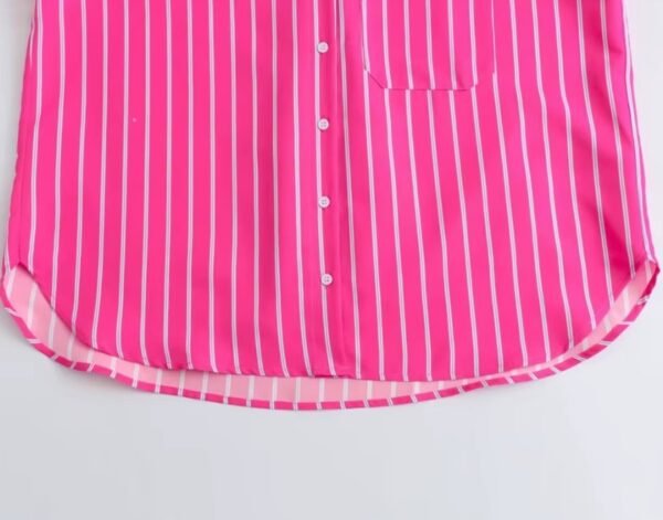 bottom part of pink colorful blouse on the white background