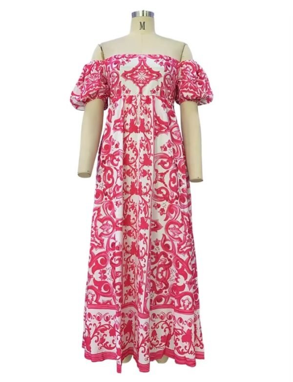 pink colorful bohemian dress on a mannequin, white background