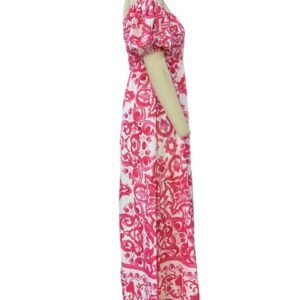 side view of pink colorful bohemian dress on a mannequin, white background