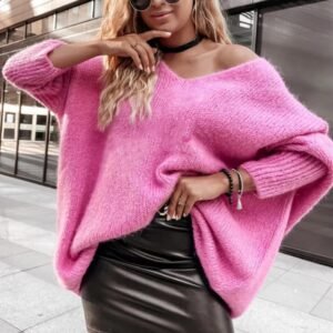 woman wearing pink colorful knitted sweater and black pencil skirt on the street