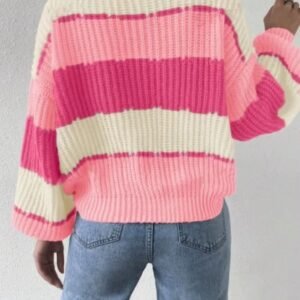 woman turned to her back wearing pink colorful sweater and jeans