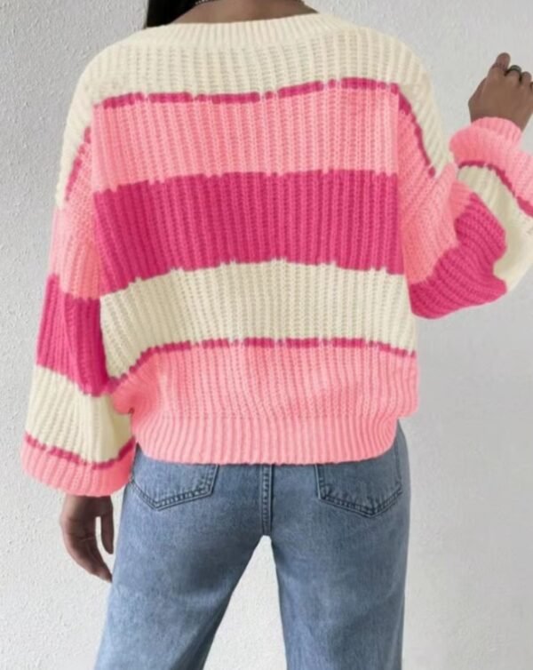 woman turned to her back wearing pink colorful sweater and jeans