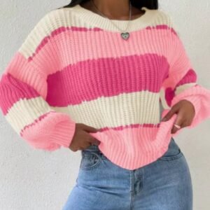 woman wearing pink colorful sweater, jeans and a silver necklace