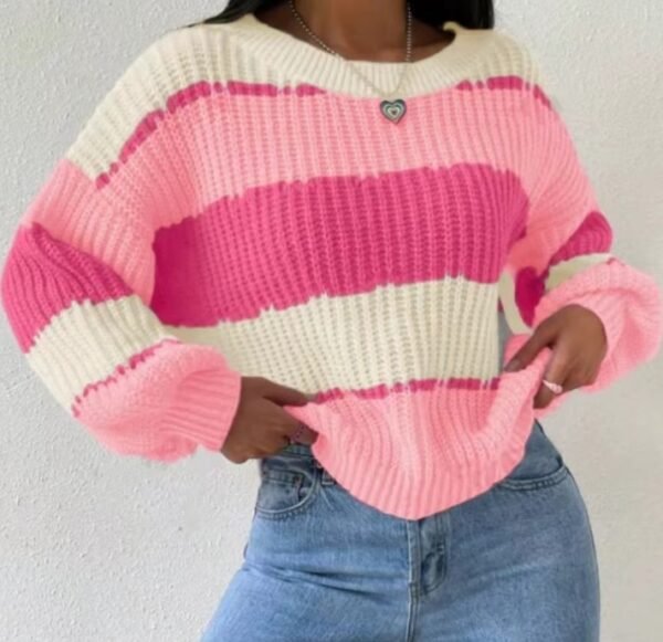 woman wearing pink colorful sweater, jeans and a silver necklace