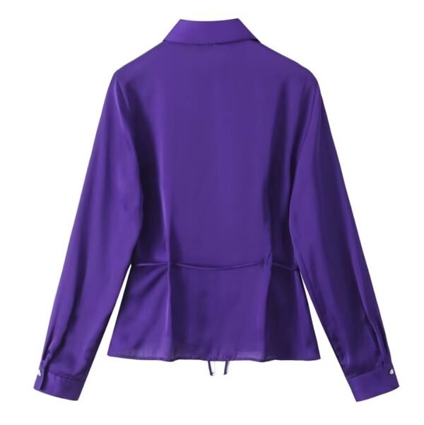 back view of the purple blouse on the white background