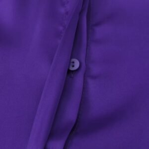 the button of the purple blouse