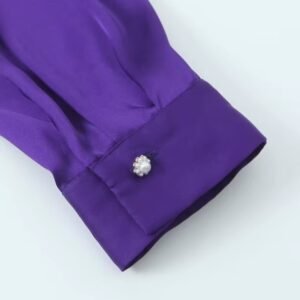 sleeve of purple blouse on the white background