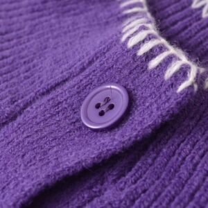 button of purple cardigan