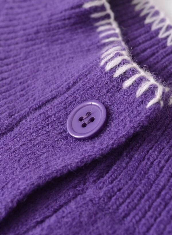 button of purple cardigan