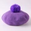 purple colorful winter beret on the white background