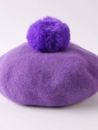 purple colorful winter beret on the white background