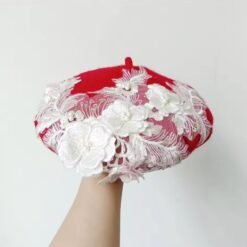red colorful lace beret on the white background