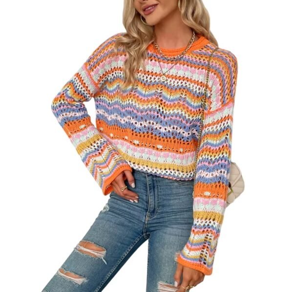 woman standing in retro colorful sweater and jeans