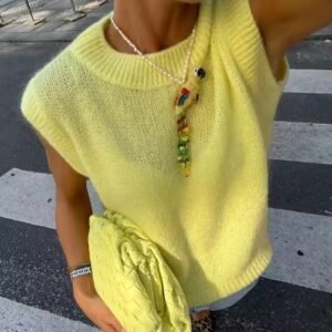 woman wearing short-sleeved colorful sweater and a colorful necklace