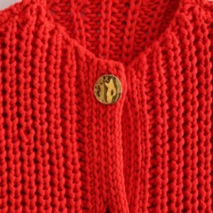 button and material of red sleeveless cardigan