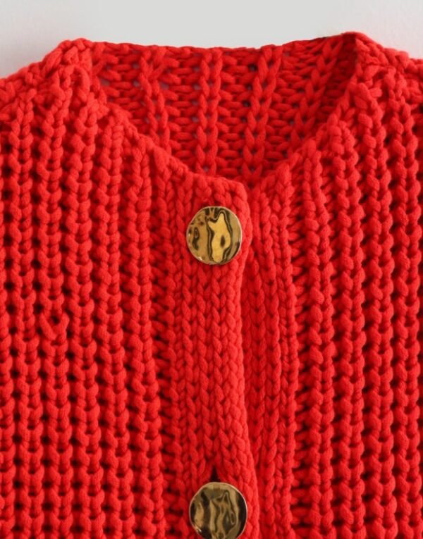 button and material of red sleeveless cardigan