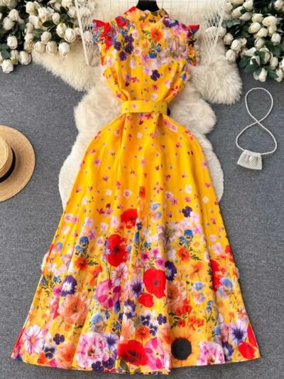 back side of spring colorful dress on a grey carpet, a beige hat and a silver purse next to it