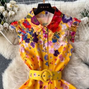 collar and upper part of spring colorful dress on a white carpet