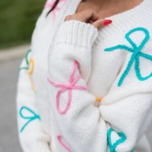 woman turned to her side wearing sweet colorful cardigan