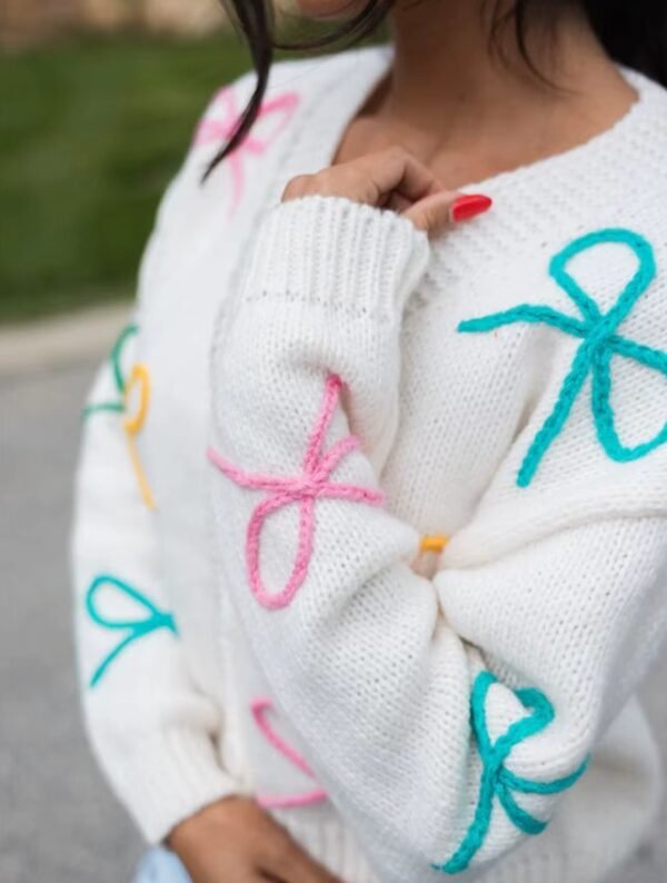 woman turned to her side wearing sweet colorful cardigan