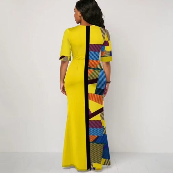 woman turned to her back wearing yellow colorful dress for women, white wall behind her