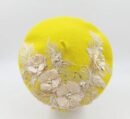 yellow colorful lace beret on the white background