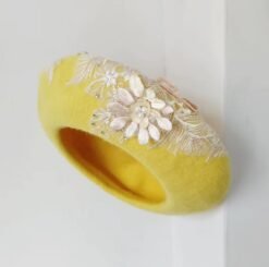 sideview of yellow colorful lace beret on the white background