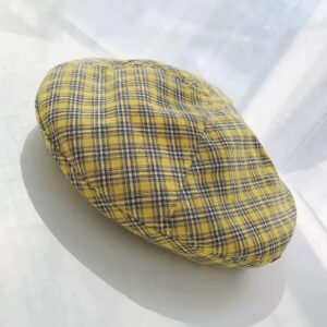 yellow plaid colorful beret on the white background