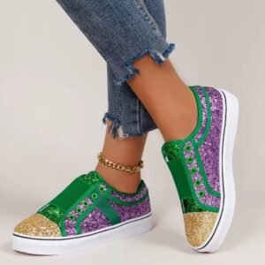 woman wearing bling colorful sneakers, jeans and a golden ankle bracelet