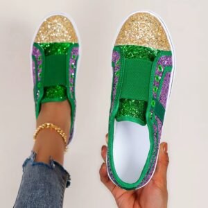 woman holding one of bling colorful sneakers and wearing the other one