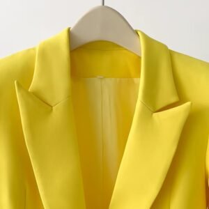 collar of bold colorful blazer on a hanger