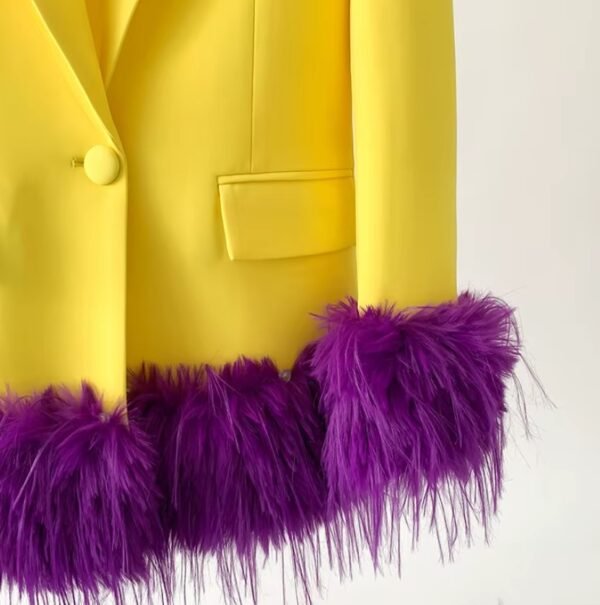 bottom part and purple feathers of bold colorful blazer