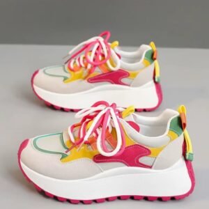 side view of casual colorful sneakers on the grey background