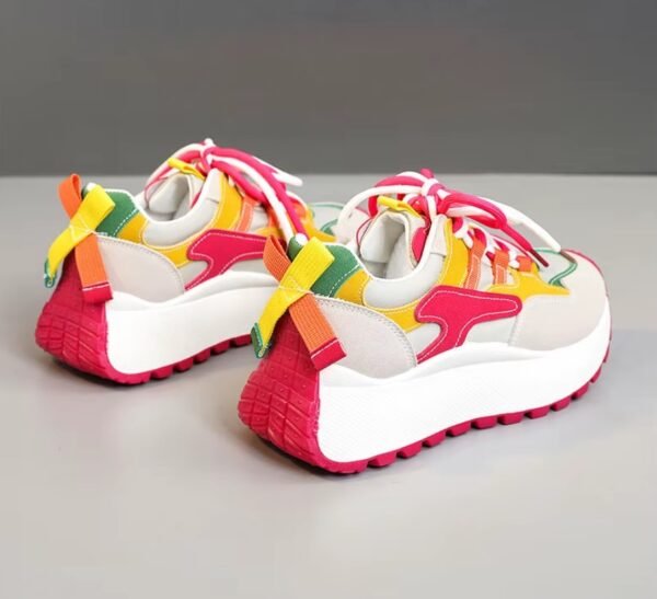 back view of casual colorful sneakers on the grey background