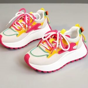 front view of casual colorful sneakers on the grey background