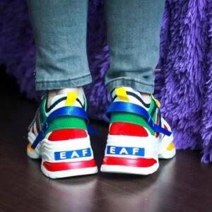 woman turned to her back wearing chunky colorful sneakers and jeans