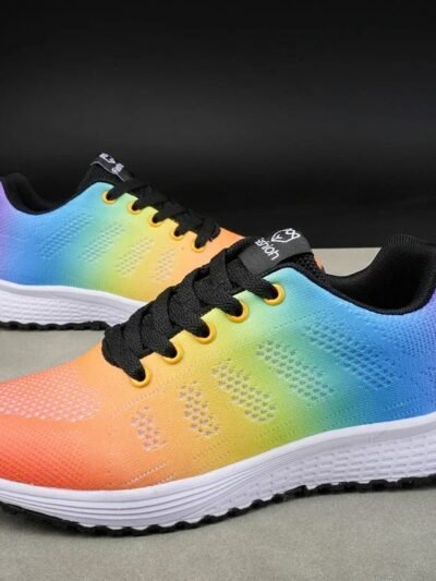 side view of colorful anti slip sneakers lying on a grey ground