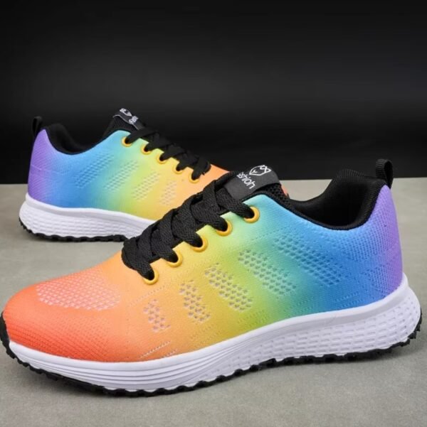 colorful anti slip sneakers lying on a grey ground