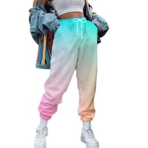 woman wearing colorful cargo pants, white sneakers, white top and jeans jacket, white background