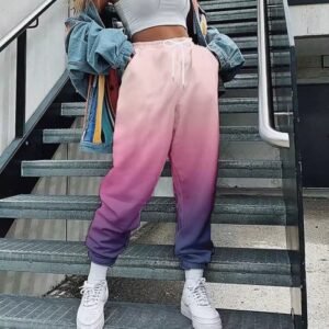 woman wearing purple colorful cargo pants and standing on the grey stairs